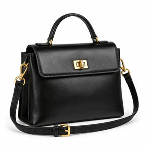 Bolsa Feminina em Couro Preta Louise — vista lateral com alça de mão, tiracolo ajustável e fecho giratório dourado estilo satchel