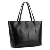 Foto de estúdio da Bolsa Feminina em Couro Tote Élise Preta com fundo branco isolado.