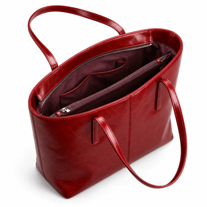 Interior vinho da Bolsa Tote Élise Red com bolsos e divisão central com zíper
