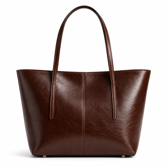Bolsa Tote Élise Coffee em couro marrom, vista frontal em fundo branco